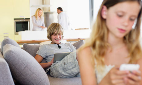 Andrex: Teenage boy using a digital tablet on a couch