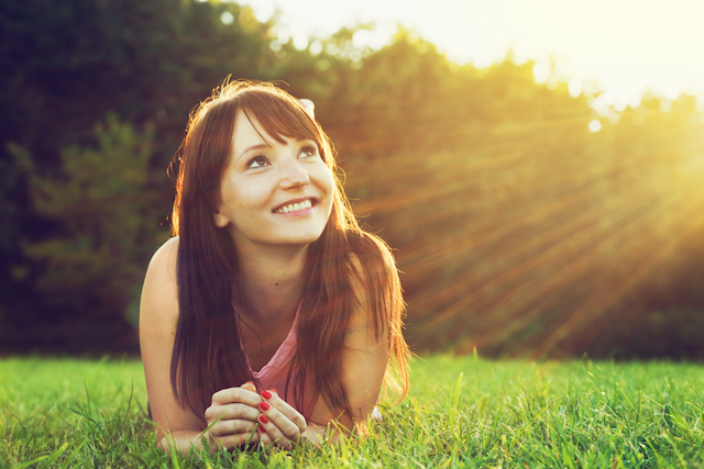Happy-Woman-on-Grass