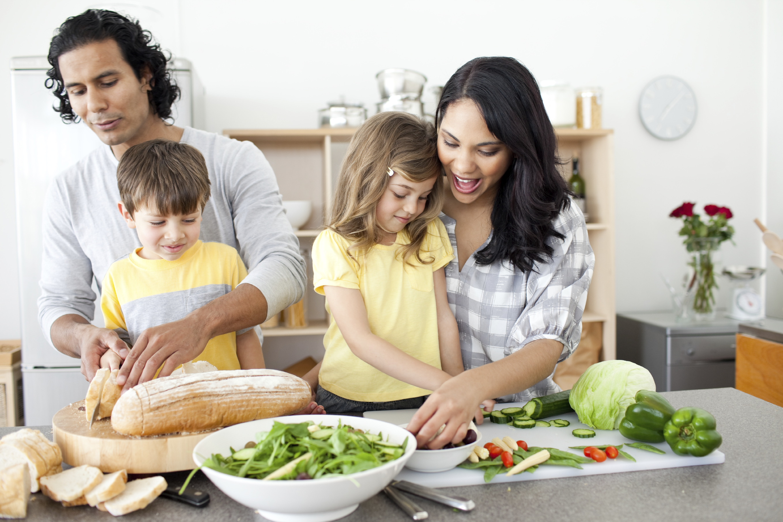 Positive family preparing lunch together